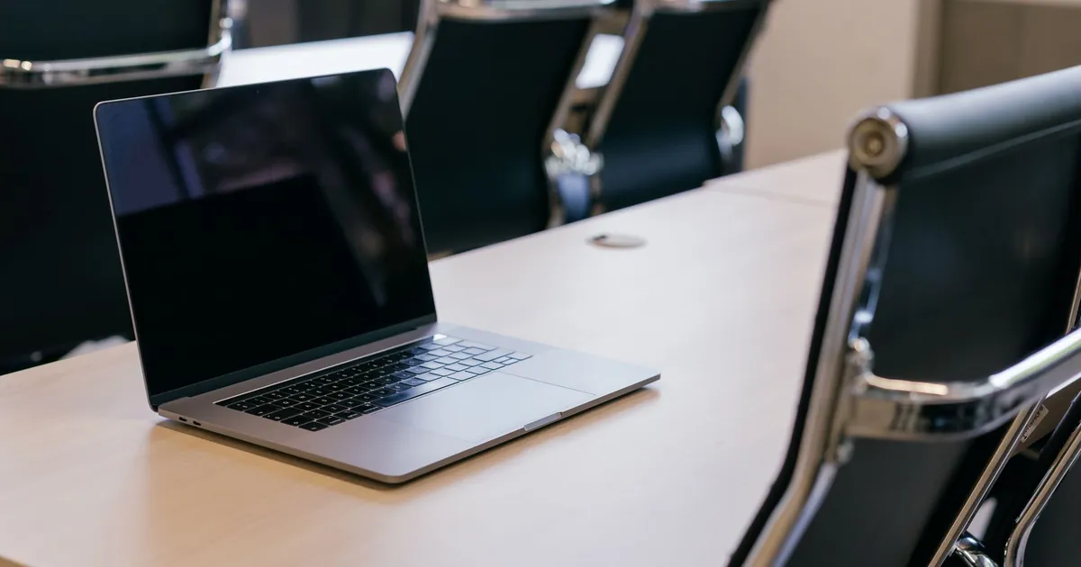 Empty conference room with a laptop