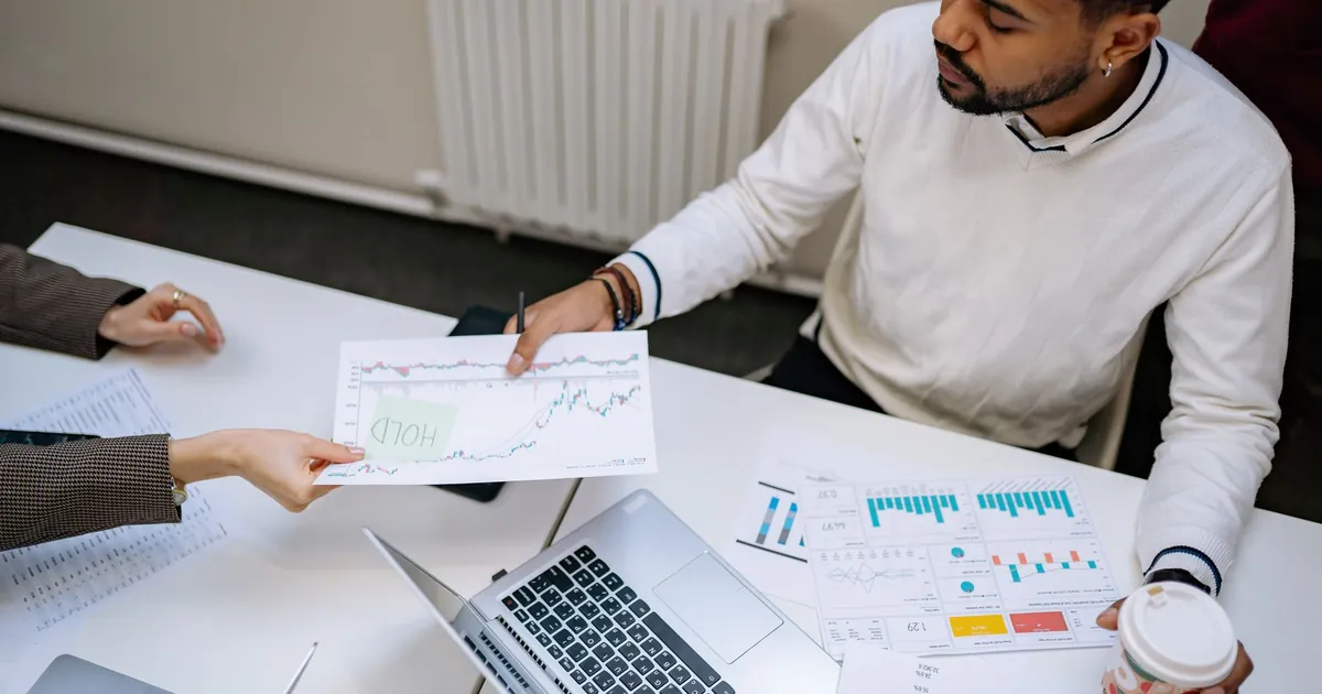 Laptops and documents on a conference table