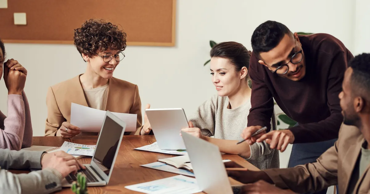 Same-day block and revoke, then mailbox and OneDrive IT admin reviewing a leaver checklist on a workstation