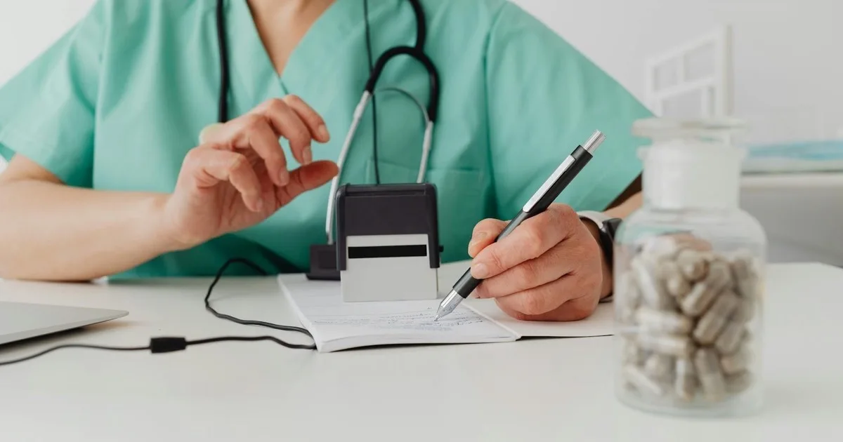 Doctor using a laptop while protecting patient health information