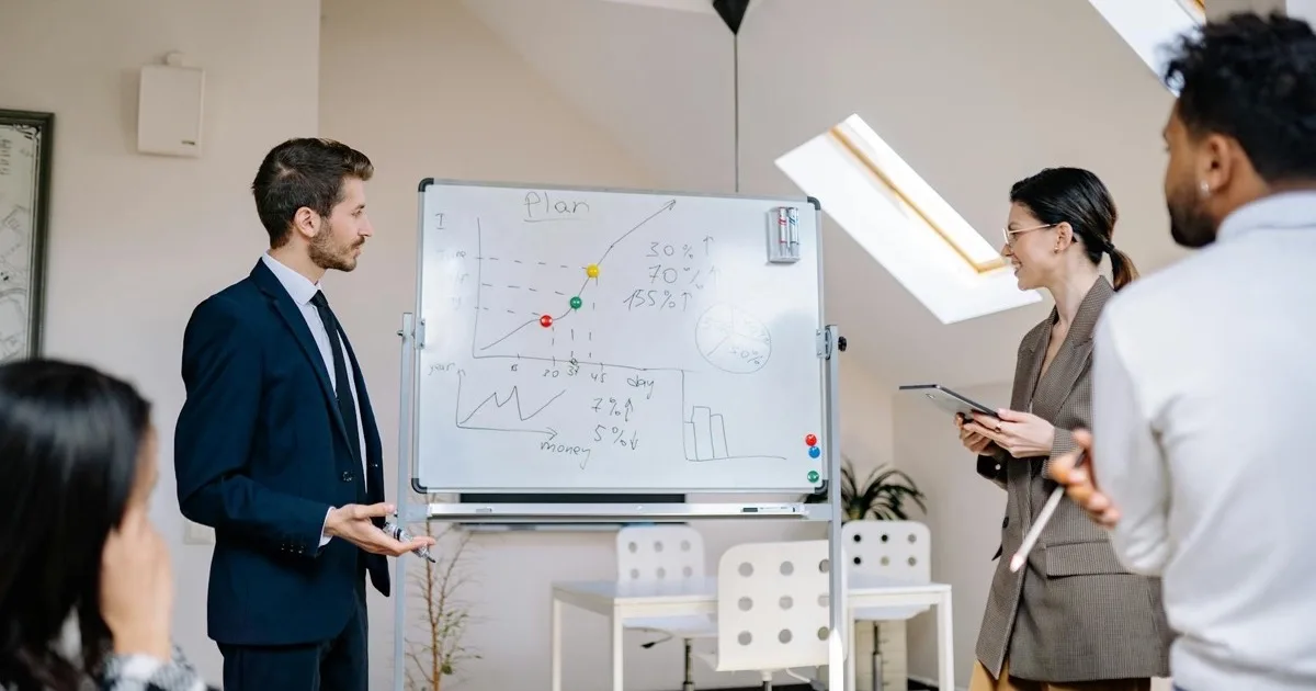 Strategic IT consulting aligns technology with business goals IT consultants planning a technology roadmap on a whiteboard