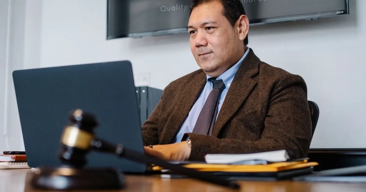 Law firms need IT support built around confidentiality and uptime Attorney working securely on a laptop in a law office