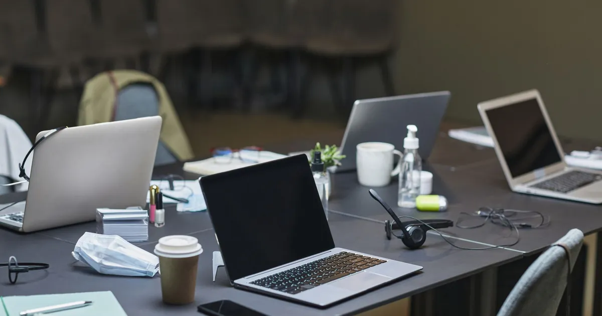 Conference table with laptops after a working session