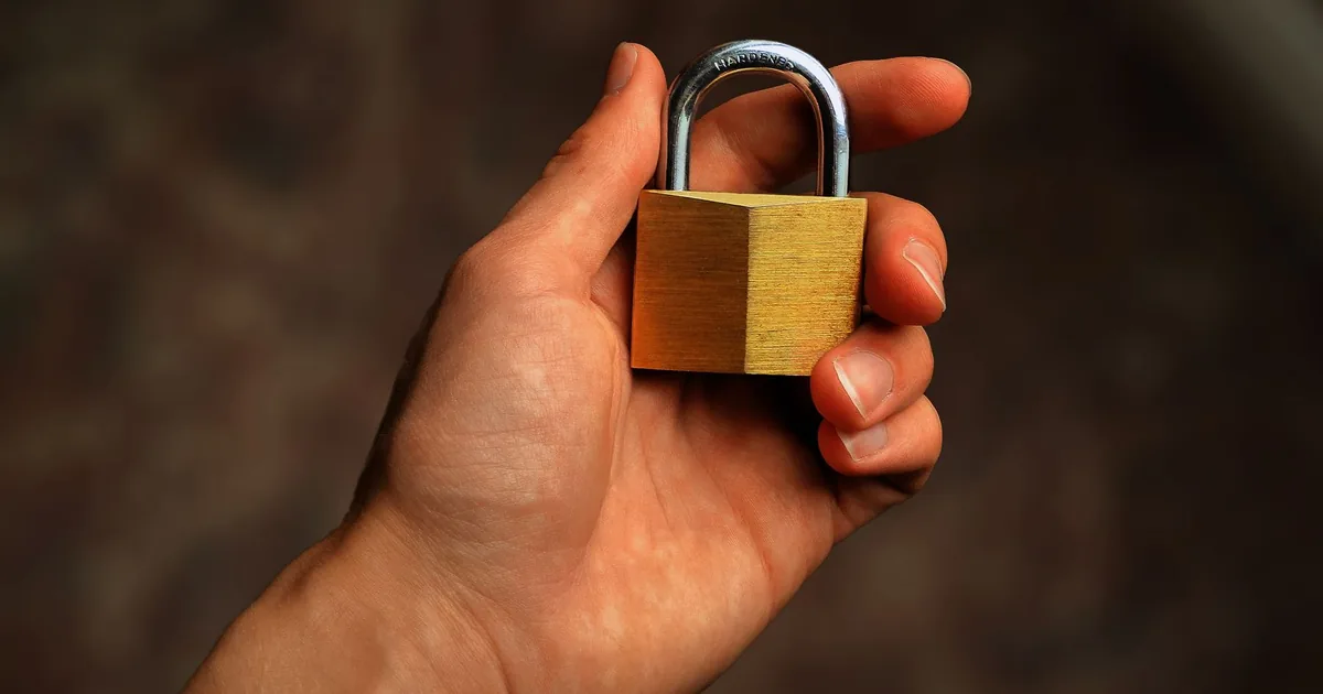 Unique passwords for every account break the credential-stuffing chain A person logging in securely on a laptop