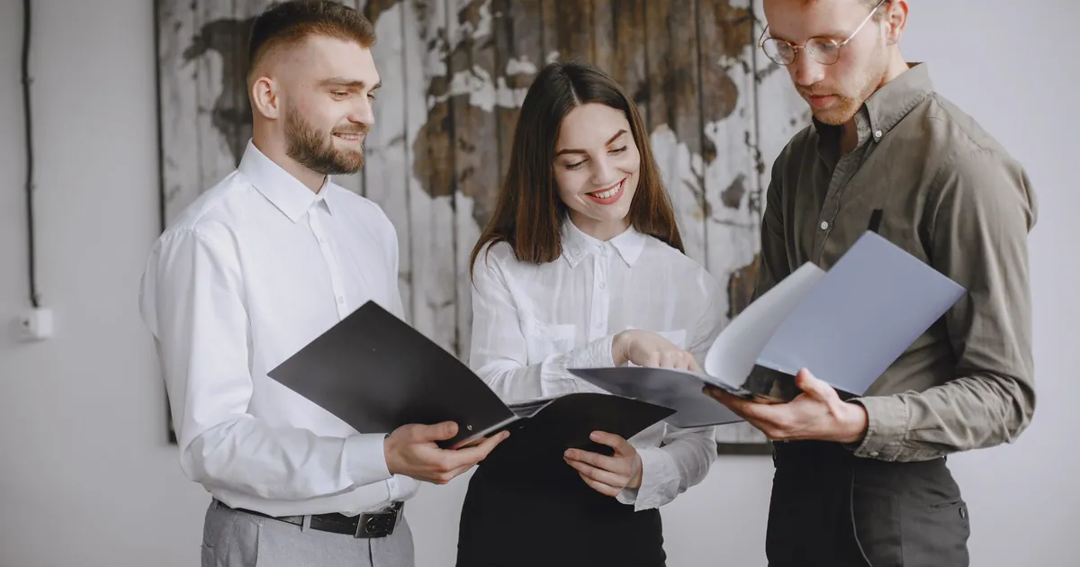 Unification only works if someone still owns the case Three people reviewing a unified security case together in an office