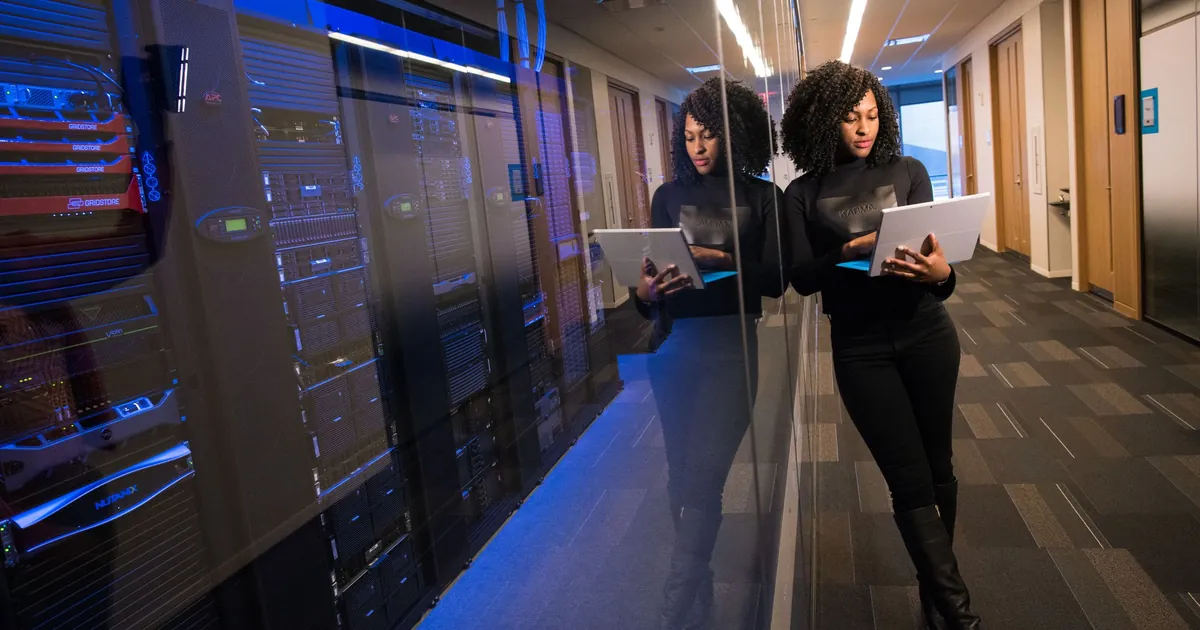 Every console you add is another stream. Unify the ones you will actually read Laptop in a data center aisle, a stand-in for the telemetry a unified platform has to ingest