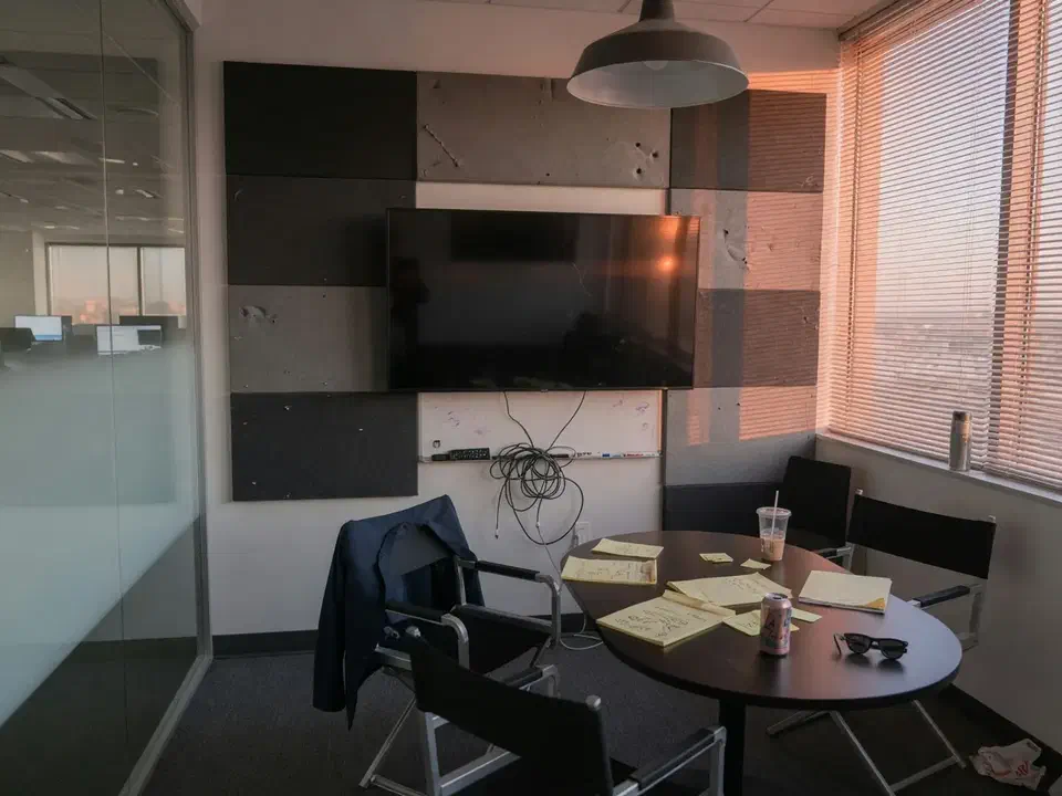 Advertising agency huddle room with a dark preview monitor