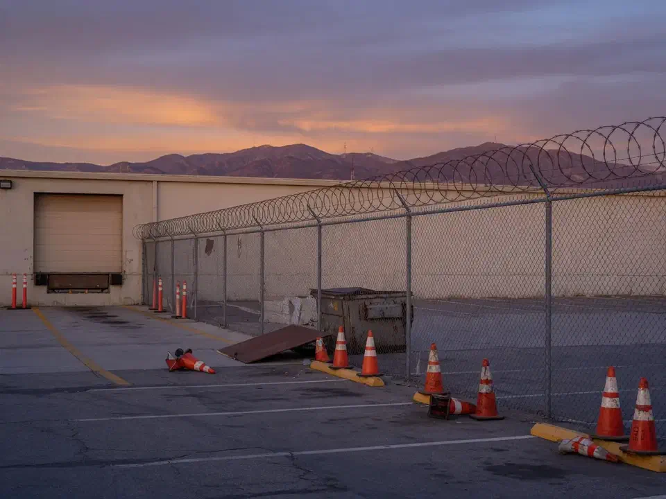 Warehouse yard and fence at dusk in Southern California